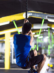 Image showing man doing rope climbing