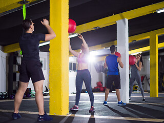 Image showing young athletes working out with medical ball