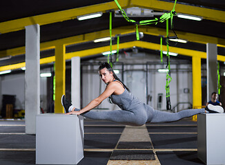 Image showing woman working out gymnastic exercise on fit boxes