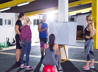 Image showing athletes getting instructions from trainer