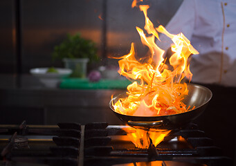 Image showing Chef doing flambe on food