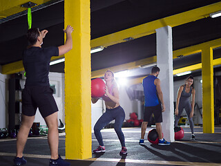 Image showing young athletes working out with medical ball