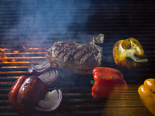 Image showing steak with vegetables on a barbecue