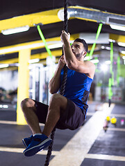 Image showing man doing rope climbing