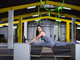 Image showing woman working out gymnastic exercise on fit boxes