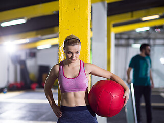 Image showing portrait of woman with red crossfitness ball