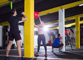 Image showing young athletes working out with medical ball