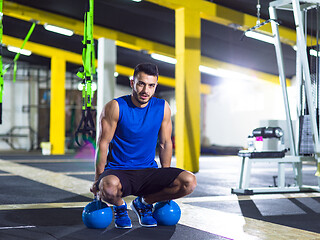 Image showing Young strong man doing pushups