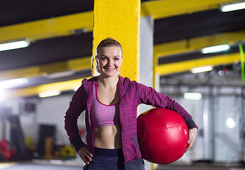 Image showing portrait of woman with red crossfitness ball