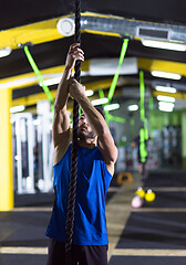 Image showing man doing rope climbing