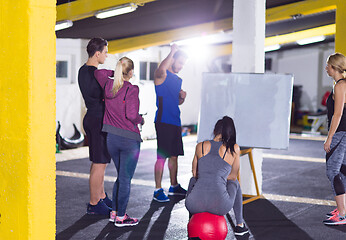 Image showing athletes getting instructions from trainer