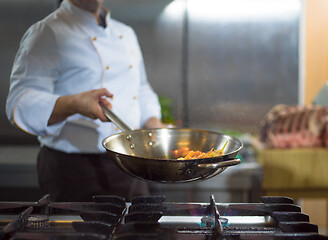 Image showing Chef doing flambe on food