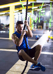 Image showing man doing rope climbing