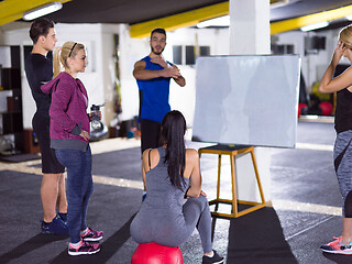 Image showing athletes getting instructions from trainer