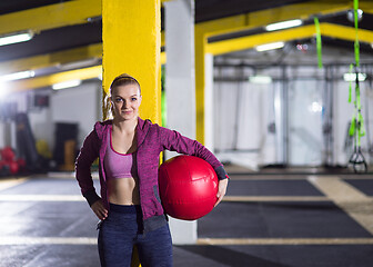 Image showing portrait of woman with red crossfitness ball