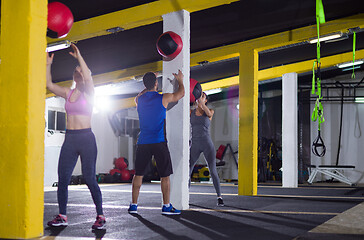 Image showing young athletes working out with medical ball