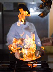 Image showing Chef doing flambe on food