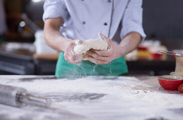 Image showing chef hands preparing dough for pizza