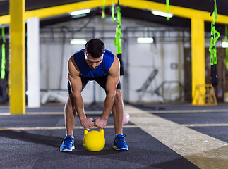 Image showing man exercise with fitness kettlebell