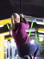 Image showing woman doing rope climbing