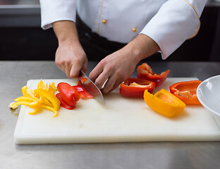 Image showing Chef cutting fresh and delicious vegetables