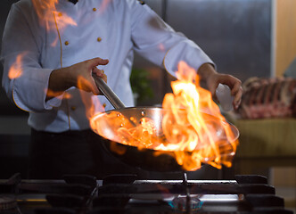 Image showing Chef doing flambe on food