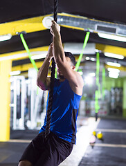 Image showing man doing rope climbing