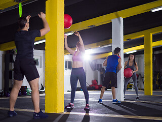 Image showing young athletes working out with medical ball