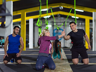 Image showing young healthy people doing pushups