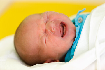 Image showing crying newborn baby infant in the hospital