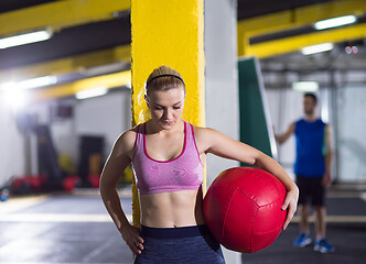 Image showing portrait of woman with red crossfitness ball