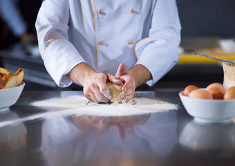 Image showing chef hands preparing dough for pizza