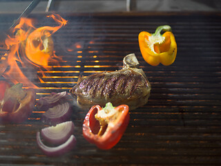 Image showing steak with vegetables on a barbecue
