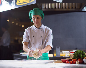 Image showing chef hands preparing dough for pizza