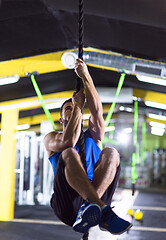 Image showing man doing rope climbing