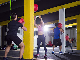 Image showing young athletes working out with medical ball