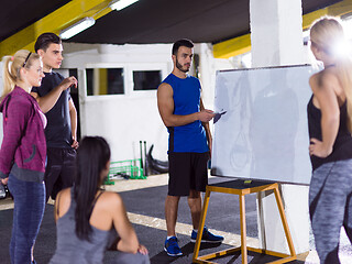 Image showing athletes getting instructions from trainer