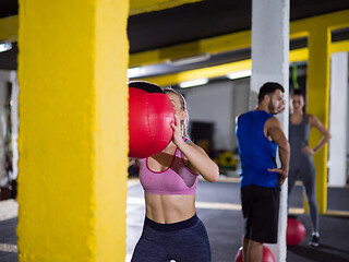 Image showing young athletes working out with medical ball