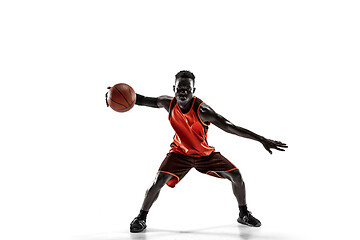 Image showing Full length portrait of a basketball player with ball