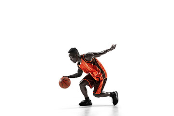 Image showing Full length portrait of a basketball player with ball