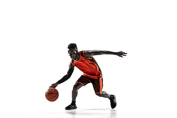 Image showing Full length portrait of a basketball player with ball