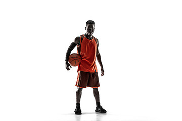 Image showing Full length portrait of a basketball player with ball