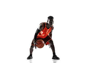 Image showing Full length portrait of a basketball player with ball