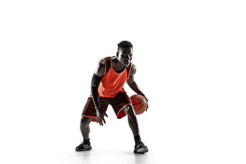 Image showing Full length portrait of a basketball player with ball