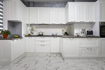 Image showing Clean and minimalistic modern white kitchen interior