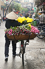 Image showing Woman selling flowers on the street in Hanoi, Vietnam