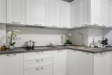 Image showing Clean and minimalistic modern white kitchen interior