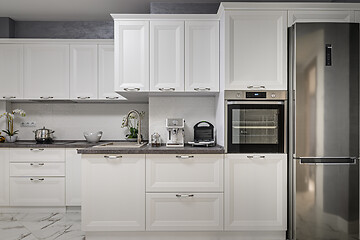 Image showing Electric appliances in minimalistic white kitchen interior