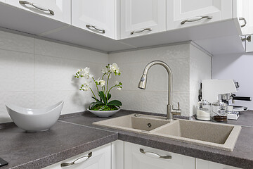 Image showing Closeup of minimalistic white kitchen furniture