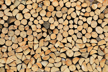 Image showing Firewood pile stacked chopped wood trunks